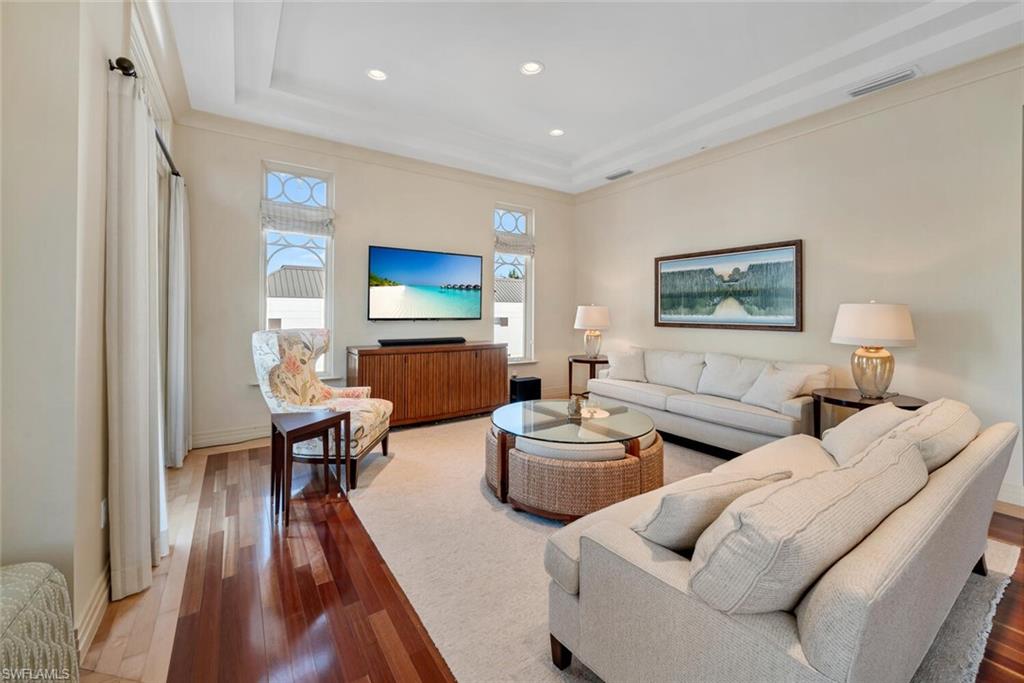 868 5th Avenue South, Unit 3A Naples, FL 34102 - Photo 5 of 21 a living room with furniture and a wooden floor