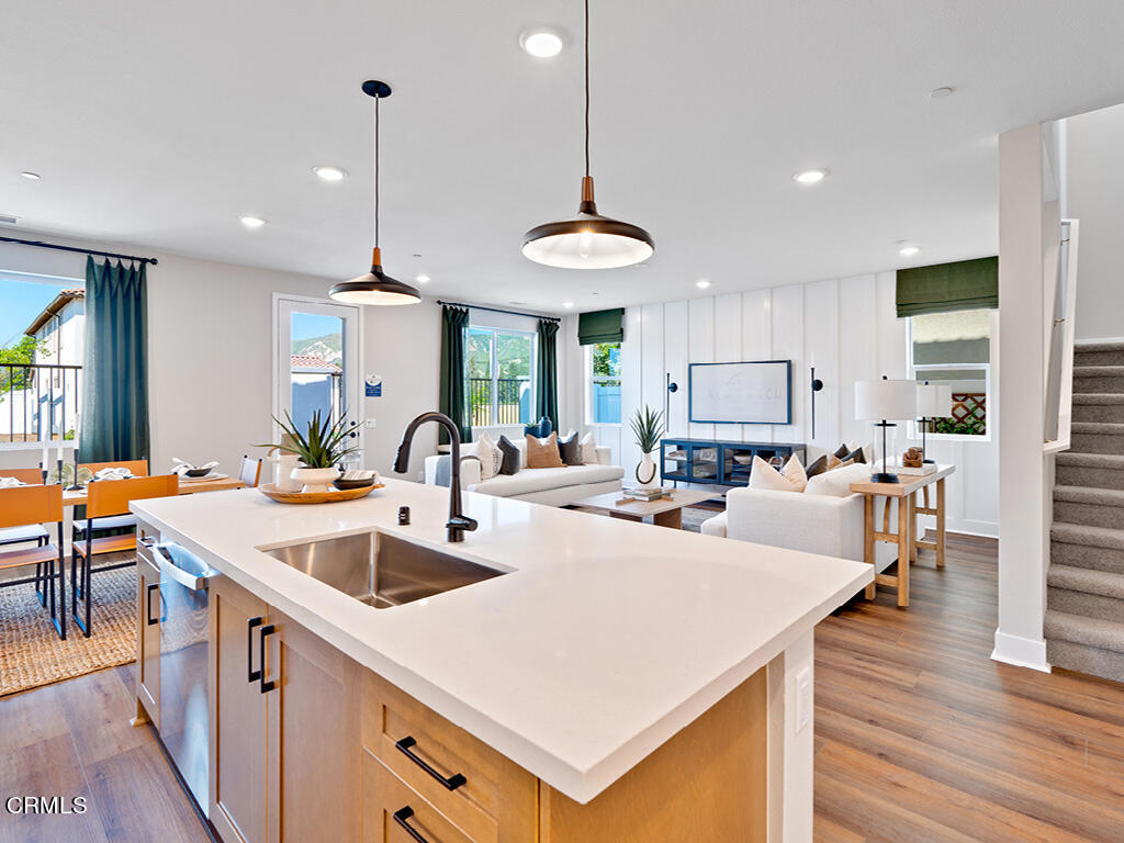 115 Yellow Birch Lane Piru, CA 93040 - Photo 4 of 18 a large kitchen with sink a counter space appliances and wooden floor