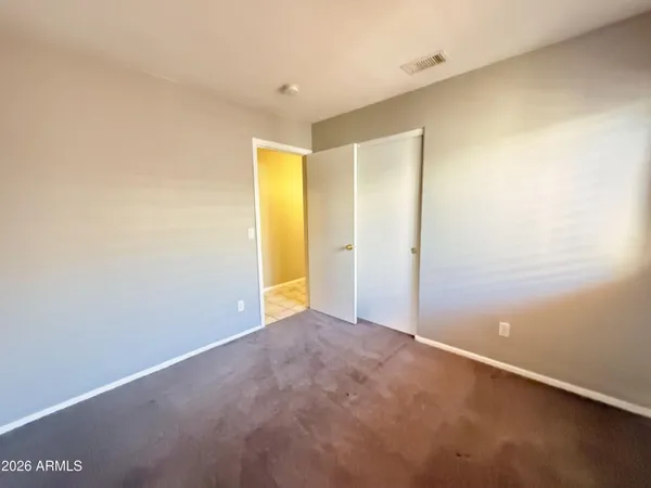 an empty room with closet