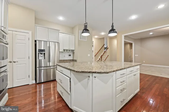 a living room with furniture fireplace and a flat screen tv