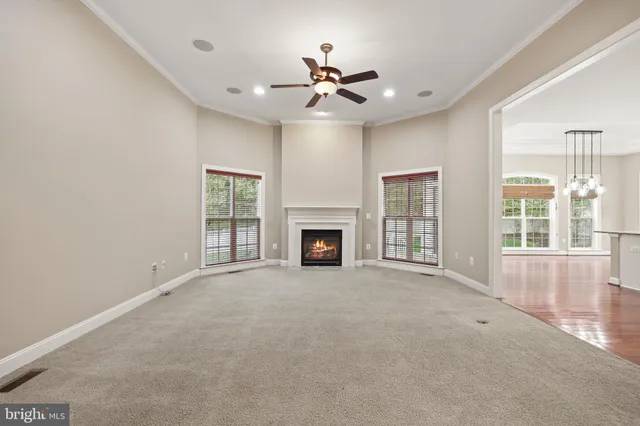 a spacious bathroom with a toilet sink and mirror