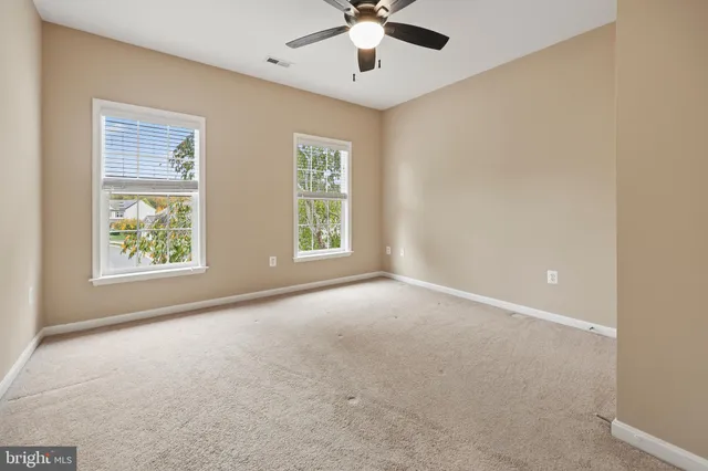 a view of an empty room with a fireplace