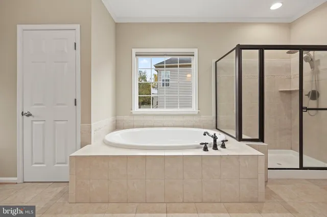 a view of a wooden deck and yard with wooden fence