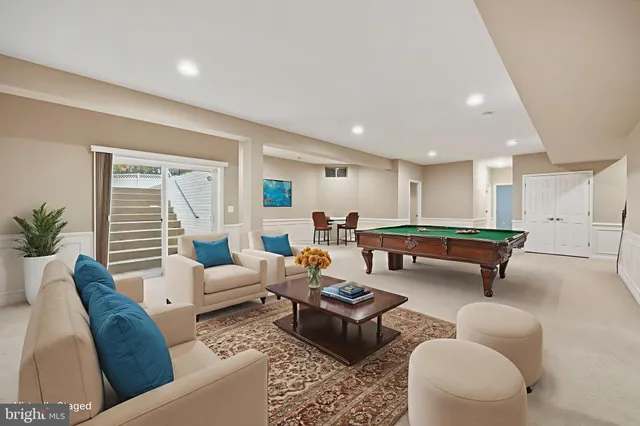 an aerial view of a house with outdoor space pool seating area and yard