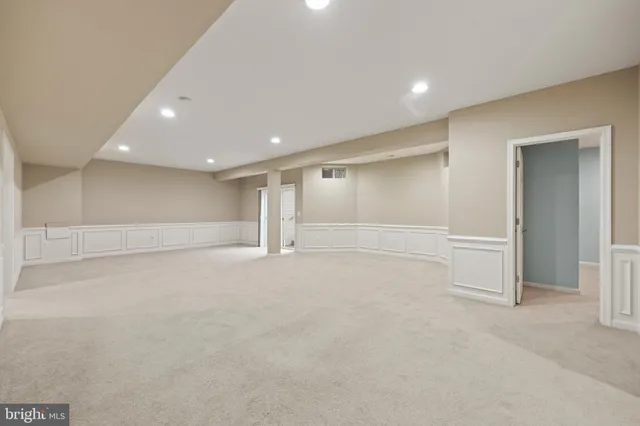 an aerial view of a house with garden space and street view