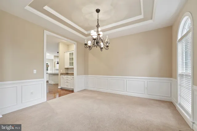 a kitchen with stainless steel appliances granite countertop a sink a stove and a wooden floors
