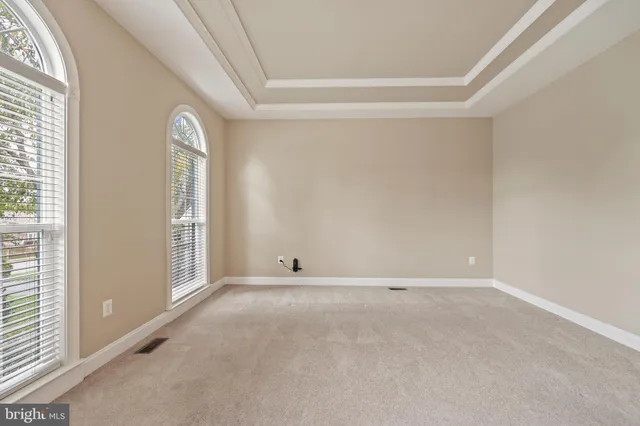 a view of a dining room with furniture wooden floor and chandelier