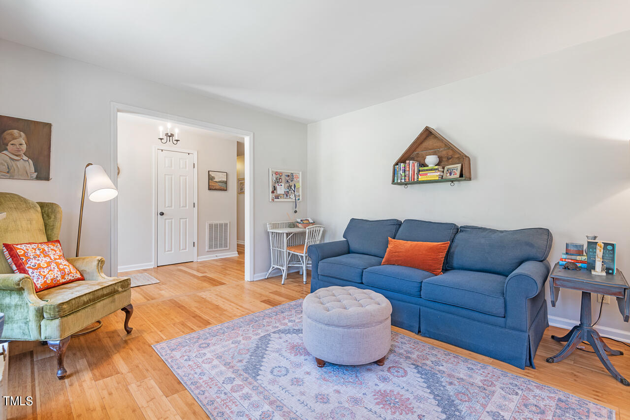 6014 Burgundy Road Durham, NC 27712 - Photo 7 of 46 a living room with furniture and a wooden floor