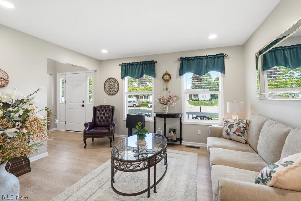 851 Susan Road Ravenna, OH 44266 - Photo 10 of 50 Recessed lighting illuminates this bright interior featuring wood-finish flooring