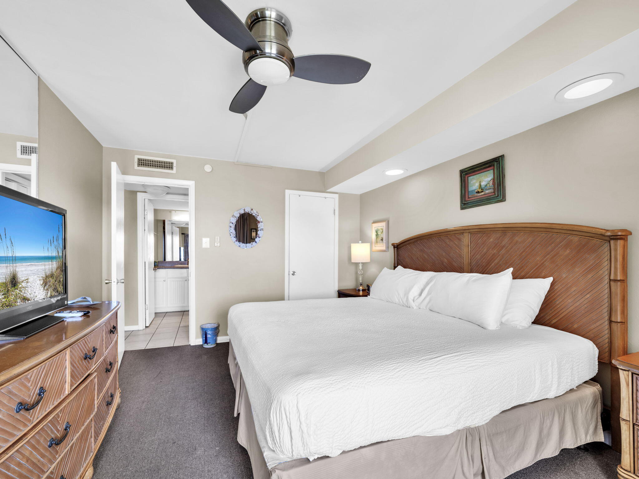 909 Santa Rosa Boulevard, Unit 165 Fort Walton Beach, FL 32548 - Photo 17 of 25 a bedroom with a large bed and a chandelier