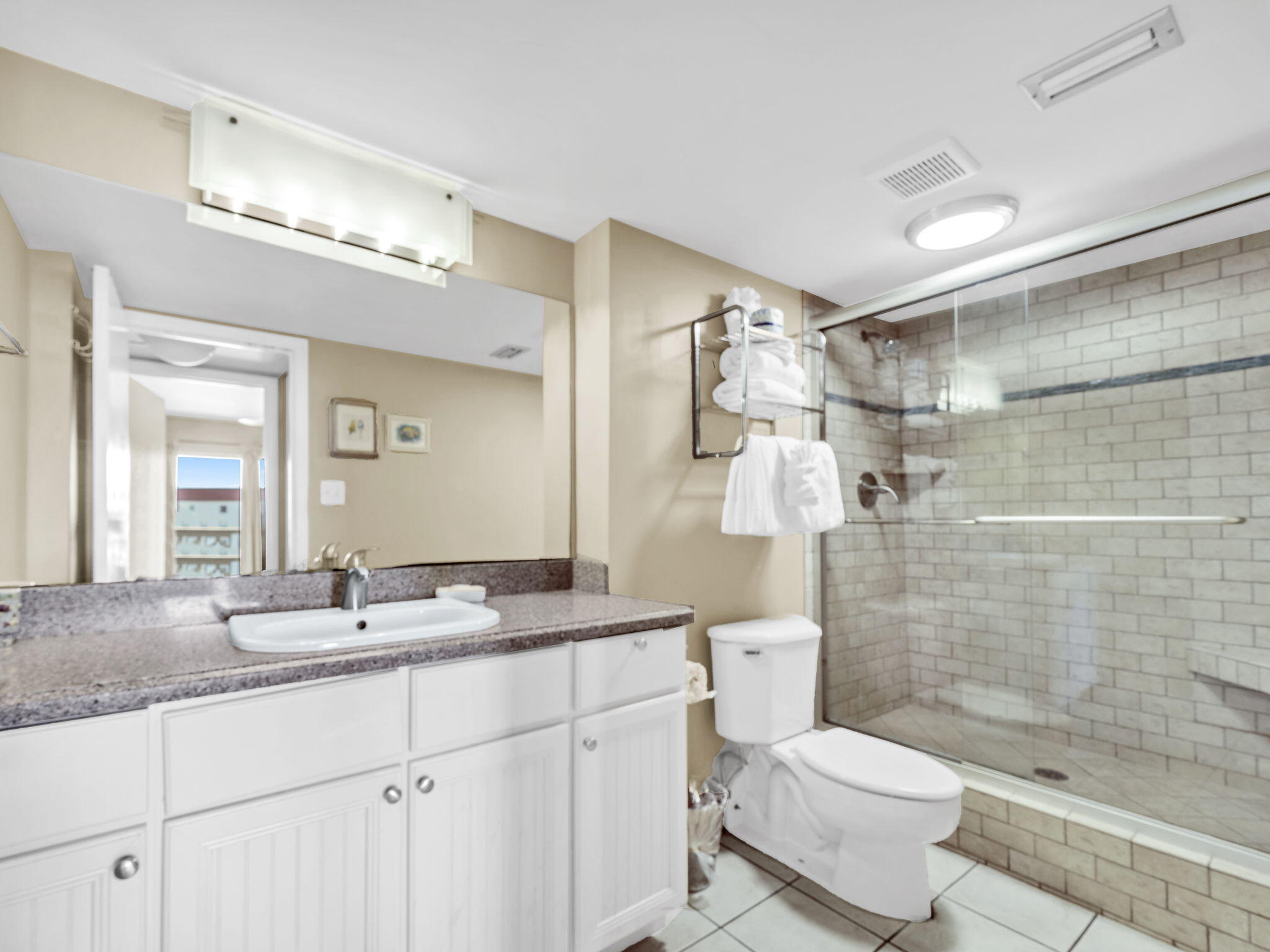 909 Santa Rosa Boulevard, Unit 165 Fort Walton Beach, FL 32548 - Photo 18 of 25 a bathroom with a double vanity sink toilet and shower