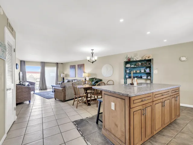 a living room with furniture a dining table and chairs
