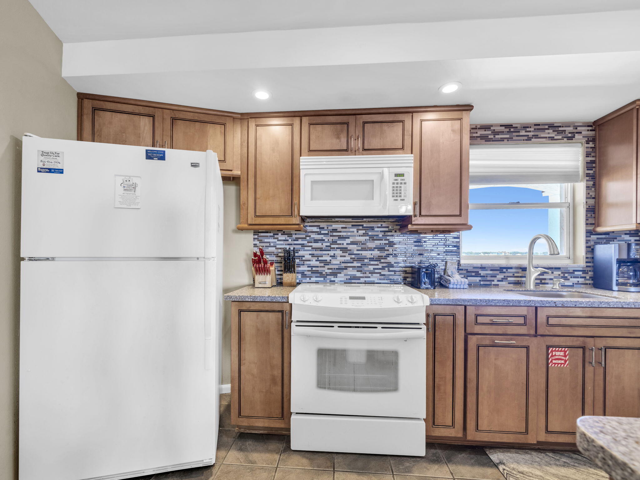 909 Santa Rosa Boulevard, Unit 165 Fort Walton Beach, FL 32548 - Photo 6 of 25 a white refrigerator freezer sitting inside of a kitchen