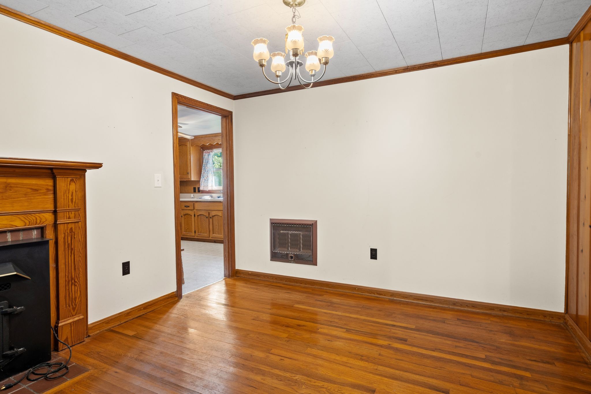 5295 Marion Road Cunningham, TN 37052 - Photo 11 of 33 a view of an empty room with wooden floor and a window