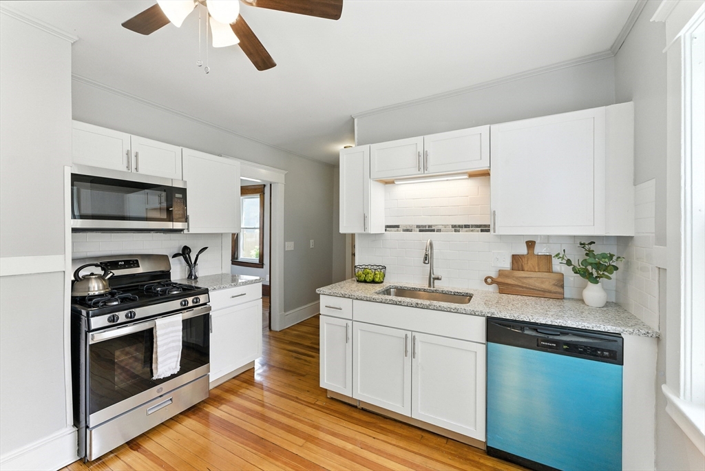 31 Fox Street West Springfield, MA 01089 - Photo 11 of 41 a kitchen with a sink stove and microwave