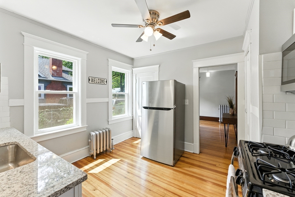 31 Fox Street West Springfield, MA 01089 - Photo 12 of 41 a kitchen with stainless steel appliances granite countertop a refrigerator and a sink