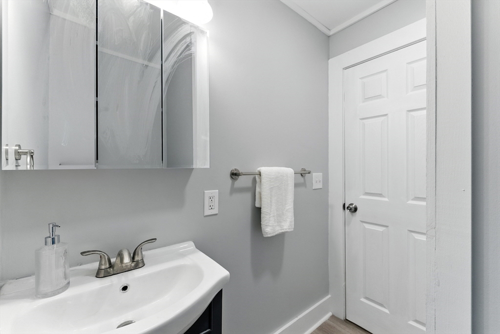 31 Fox Street West Springfield, MA 01089 - Photo 14 of 41 a bathroom with a sink and mirror