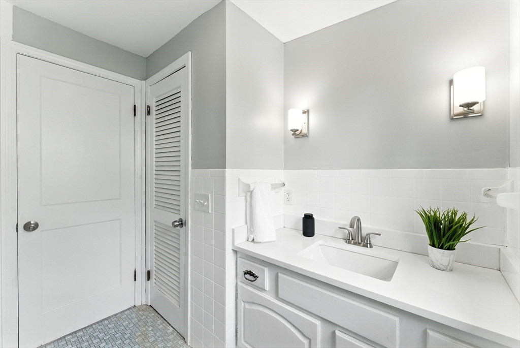 31 Fox Street West Springfield, MA 01089 - Photo 16 of 41 a bathroom with a sink a potted plant and mirror