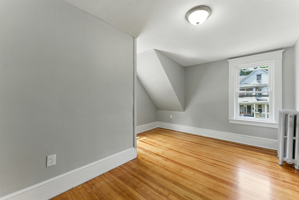 31 Fox Street West Springfield, MA 01089 - Photo 17 of 41 an empty room with wooden floor and windows