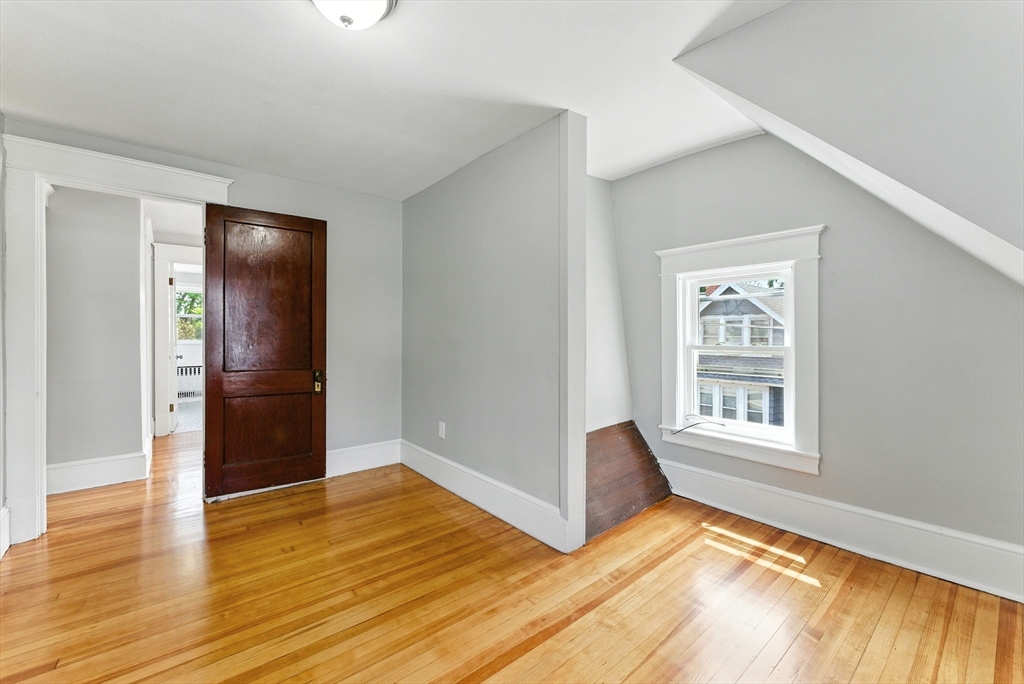 31 Fox Street West Springfield, MA 01089 - Photo 18 of 41 a view of an empty room with wooden floor and a window