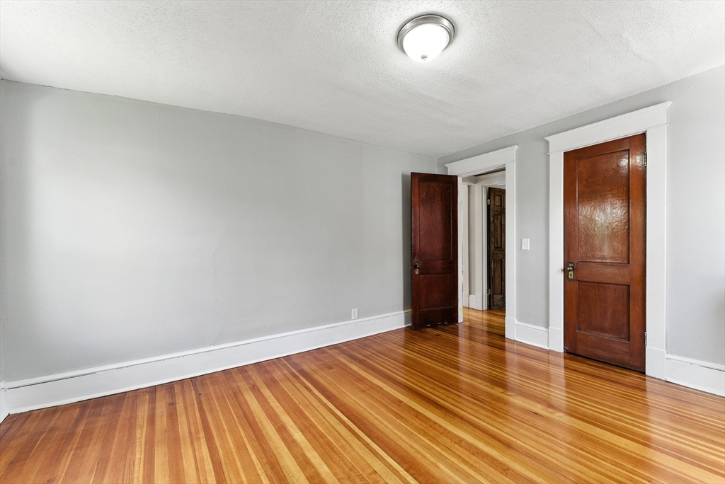 31 Fox Street West Springfield, MA 01089 - Photo 22 of 41 a view of an empty room with wooden floor