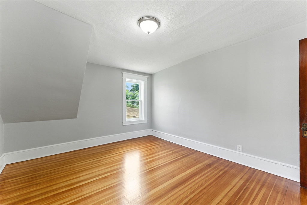 31 Fox Street West Springfield, MA 01089 - Photo 23 of 41 wooden floor in an empty room with a window
