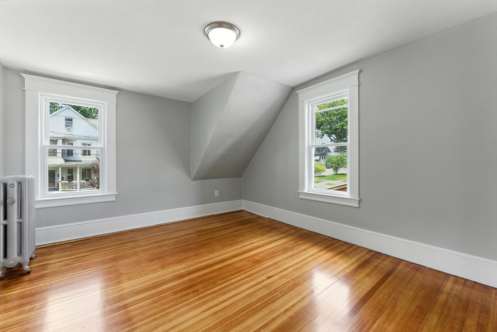 31 Fox Street West Springfield, MA 01089 - Photo 24 of 41 a view of an empty room with wooden floor and a window