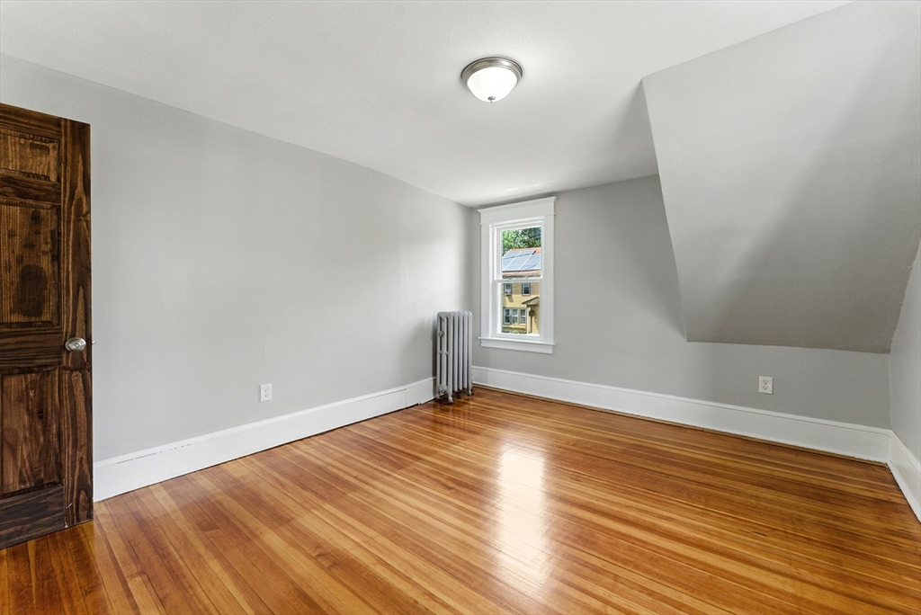 31 Fox Street West Springfield, MA 01089 - Photo 25 of 41 an empty room with wooden floor and windows