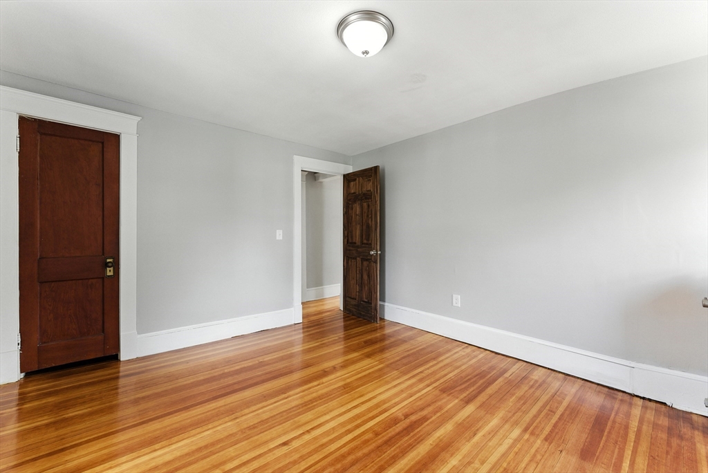 31 Fox Street West Springfield, MA 01089 - Photo 26 of 41 a view of an empty room with wooden floor