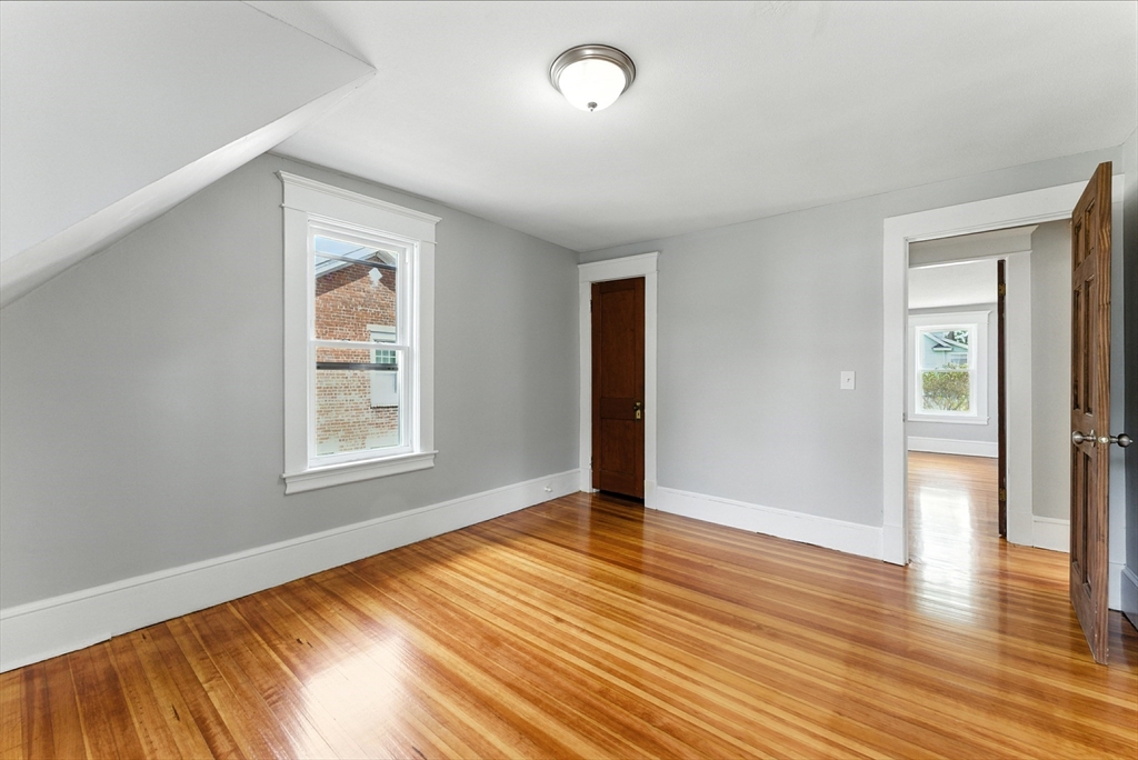 31 Fox Street West Springfield, MA 01089 - Photo 27 of 41 an empty room with wooden floor and windows