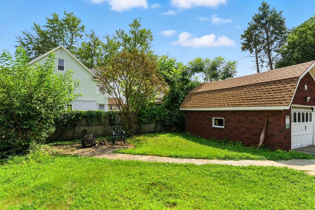 31 Fox Street West Springfield, MA 01089 - Photo 34 of 41 a view of a backyard with potted plants and large tree