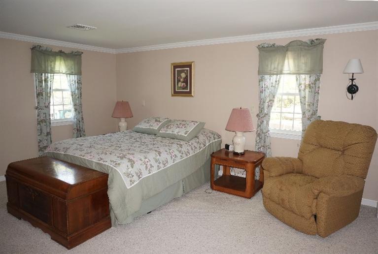 108 Old Mill Road Marstons Mills, MA 02648 - Photo 20 of 35 a bedroom with a bed and window