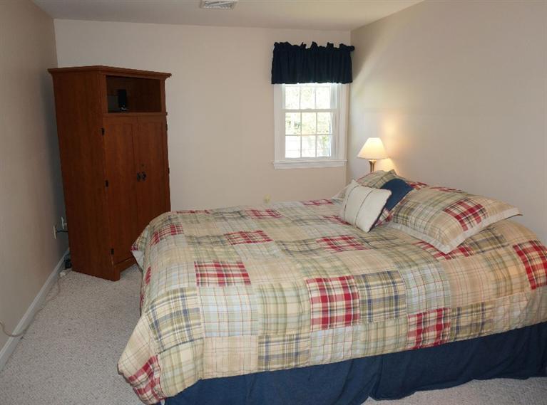 108 Old Mill Road Marstons Mills, MA 02648 - Photo 23 of 35 a bedroom with a bed and a window