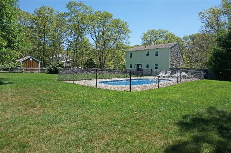 108 Old Mill Road Marstons Mills, MA 02648 - Photo 26 of 35 a view of a house with a backyard
