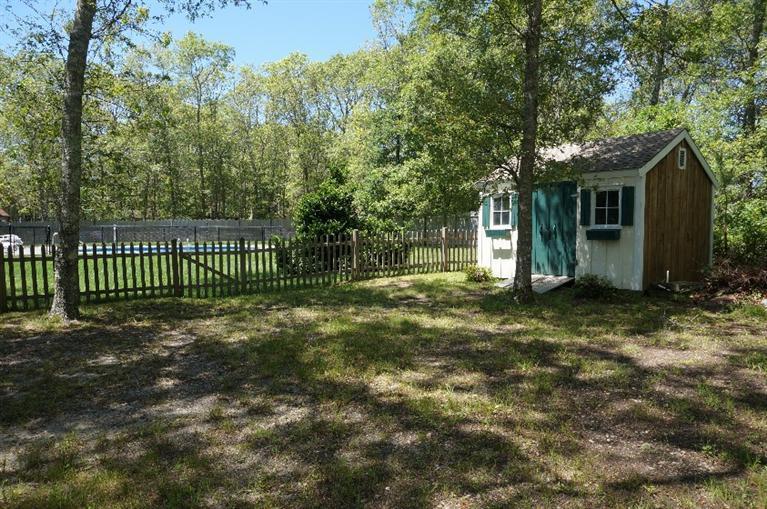 108 Old Mill Road Marstons Mills, MA 02648 - Photo 31 of 35 a view of a house with a small yard