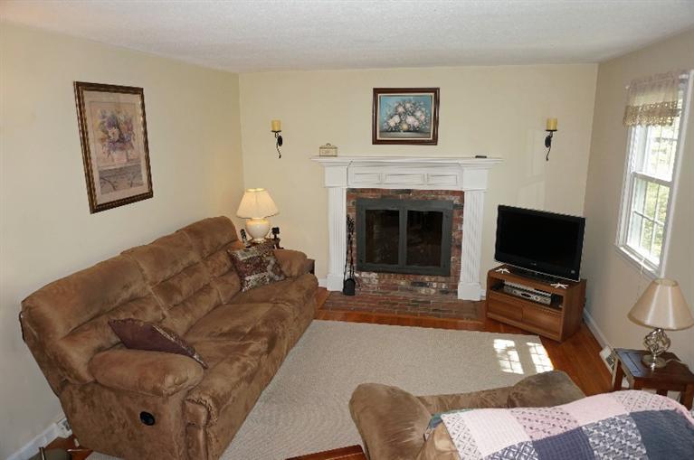 108 Old Mill Road Marstons Mills, MA 02648 - Photo 7 of 35 a living room with furniture and a fireplace