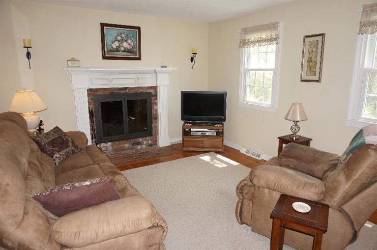 108 Old Mill Road Marstons Mills, MA 02648 - Photo 9 of 35 a living room with furniture and a fireplace