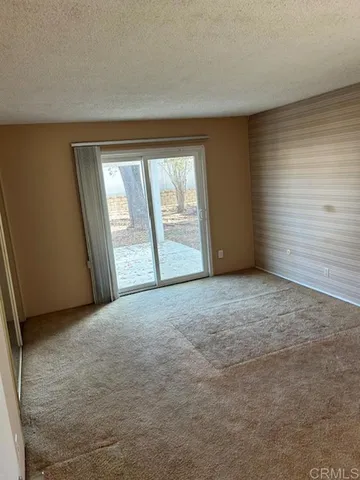 an empty room with a empty space and windows