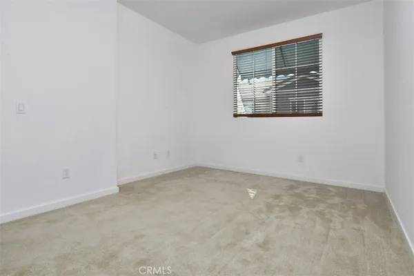 an empty room with closet area
