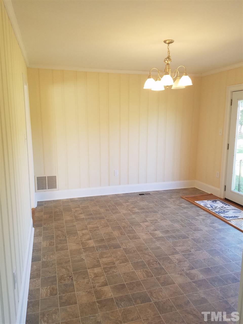 10328 Pasture Road Middlesex, NC 27557 - Photo 6 of 23 a view of an empty room and chandelier fan