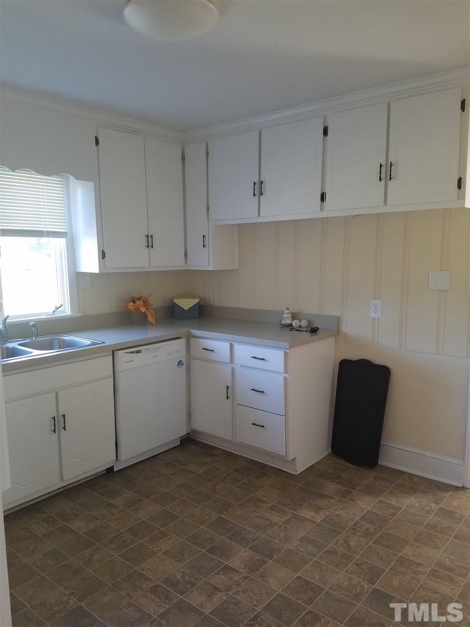 10328 Pasture Road Middlesex, NC 27557 - Photo 8 of 23 a utility room with cabinets washer and dryer
