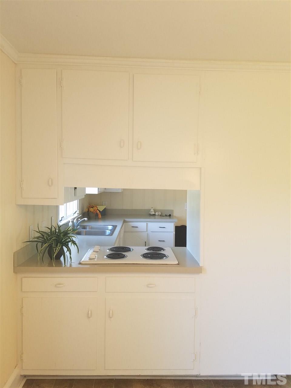 10328 Pasture Road Middlesex, NC 27557 - Photo 9 of 23 a kitchen with a sink and cabinets