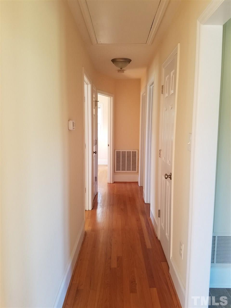 10328 Pasture Road Middlesex, NC 27557 - Photo 10 of 23 a view of a hallway with wooden floor