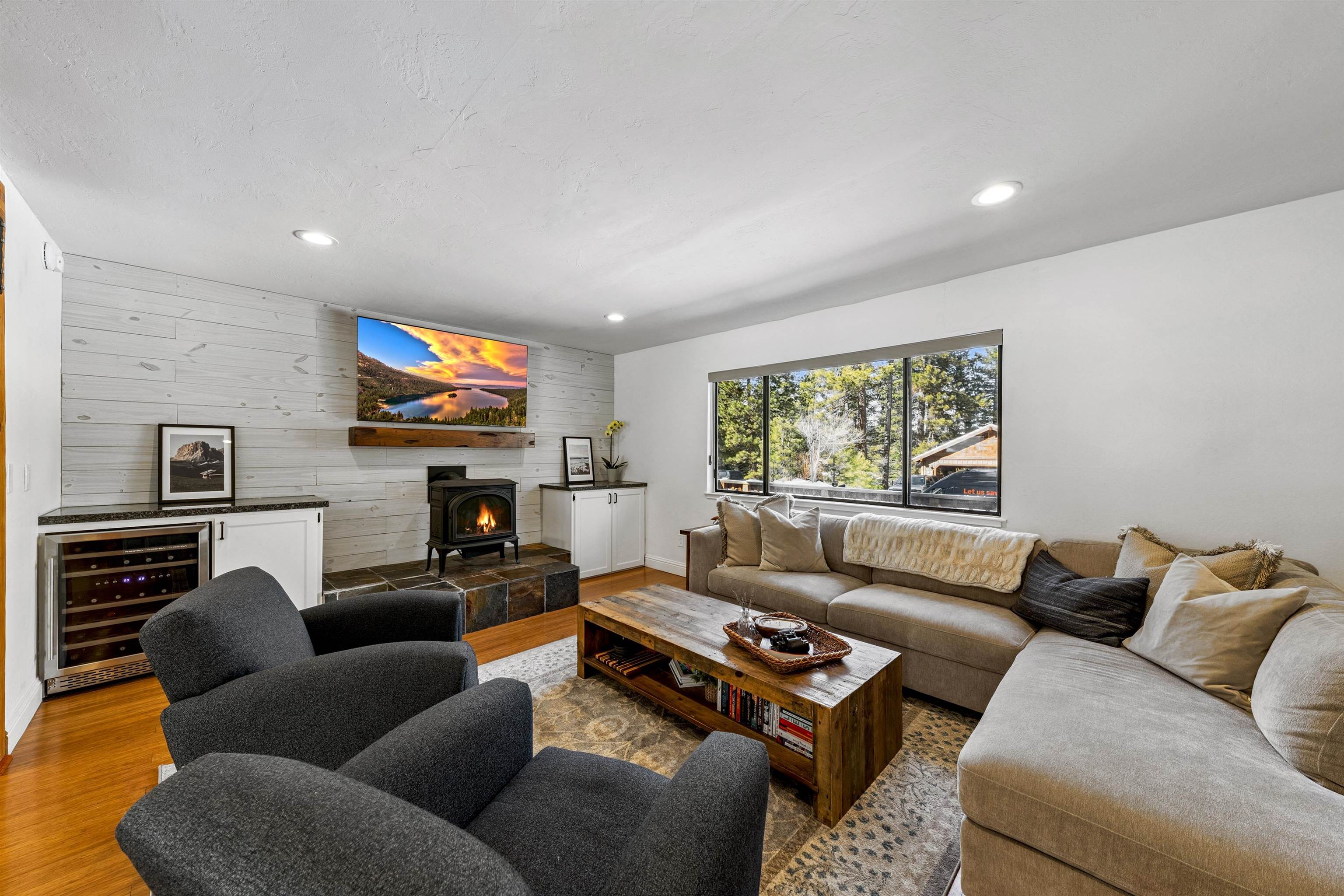 10895 Jeffery Pine Road Truckee, CA 96161 - Photo 7 of 25 a living room with fireplace furniture and a flat screen tv