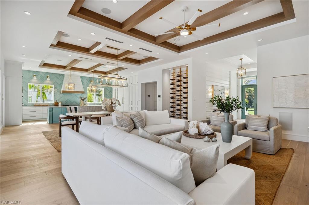 187 10th Avenue South Naples, FL 34102 - Photo 18 of 48 a living room with furniture and wooden floor