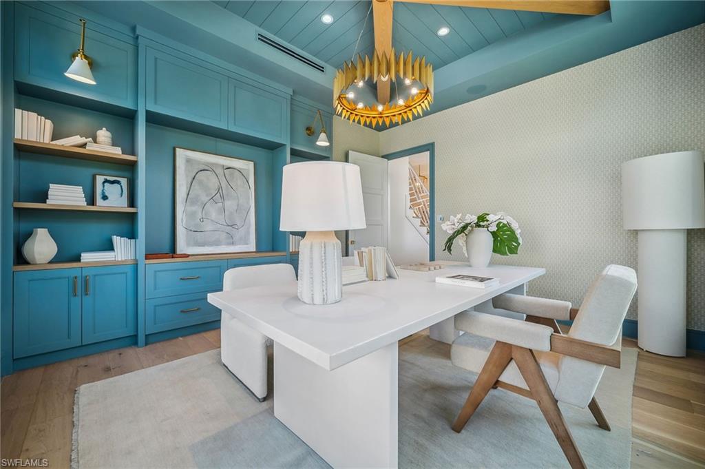 187 10th Avenue South Naples, FL 34102 - Photo 19 of 48 a kitchen with a table and chairs in it