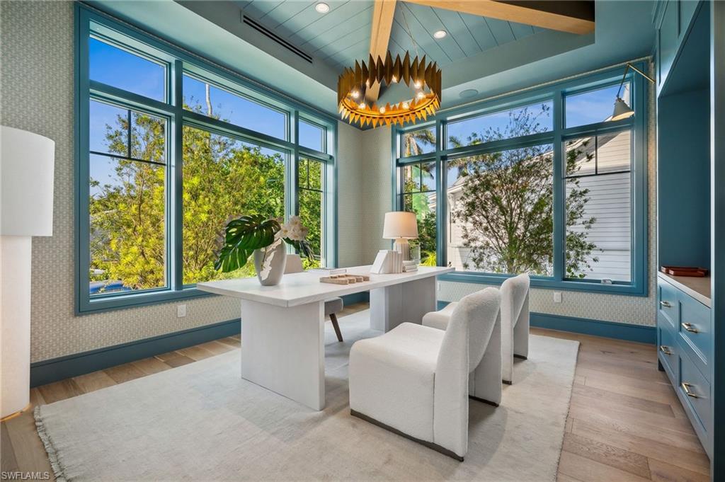 187 10th Avenue South Naples, FL 34102 - Photo 20 of 48 a living room with furniture and a large window