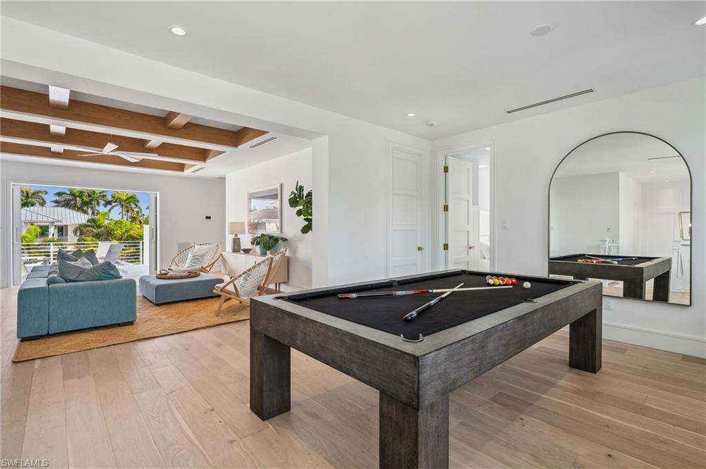 187 10th Avenue South Naples, FL 34102 - Photo 36 of 48 a kitchen that has a sink and a stove