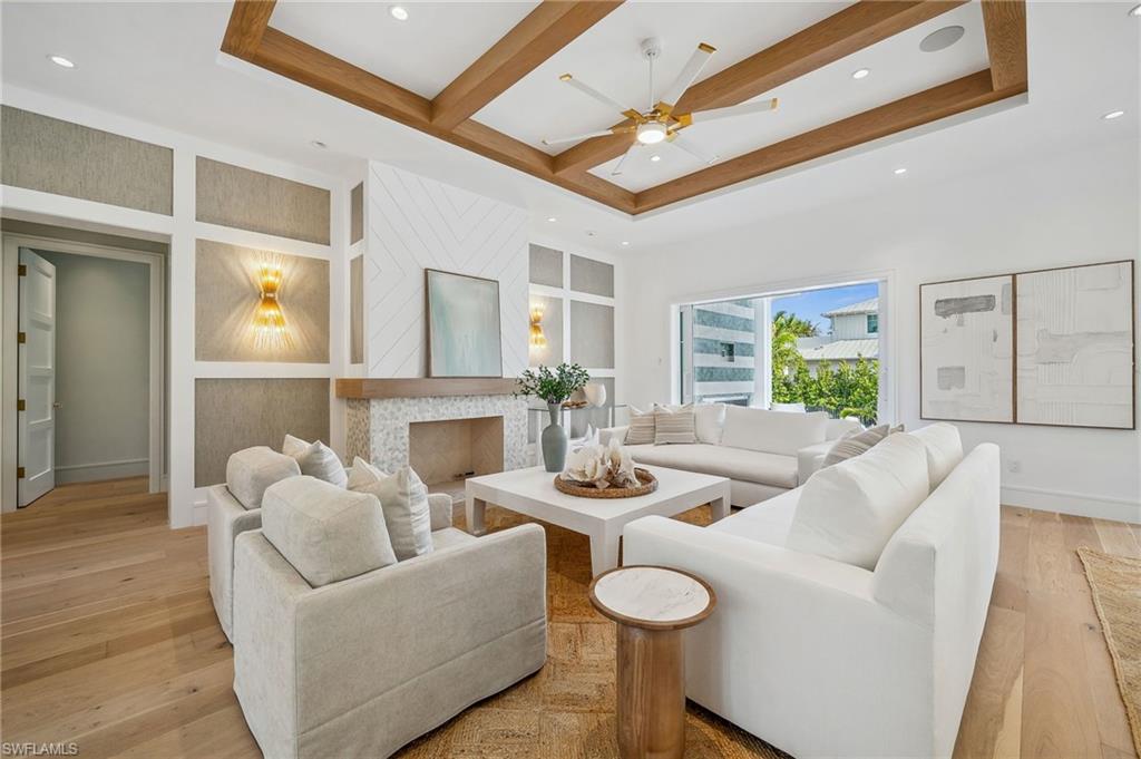 187 10th Avenue South Naples, FL 34102 - Photo 7 of 48 a living room with furniture and a wooden floor