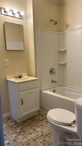a bathroom with a sink a toilet and bathtub